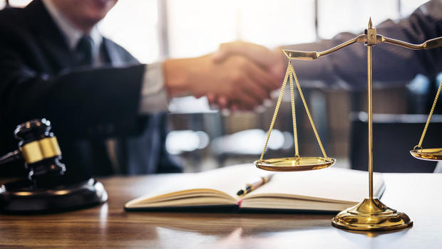 Handshake after good cooperation, Consultation between a male lawyer and businessman customer, tax and the company of real estate concept